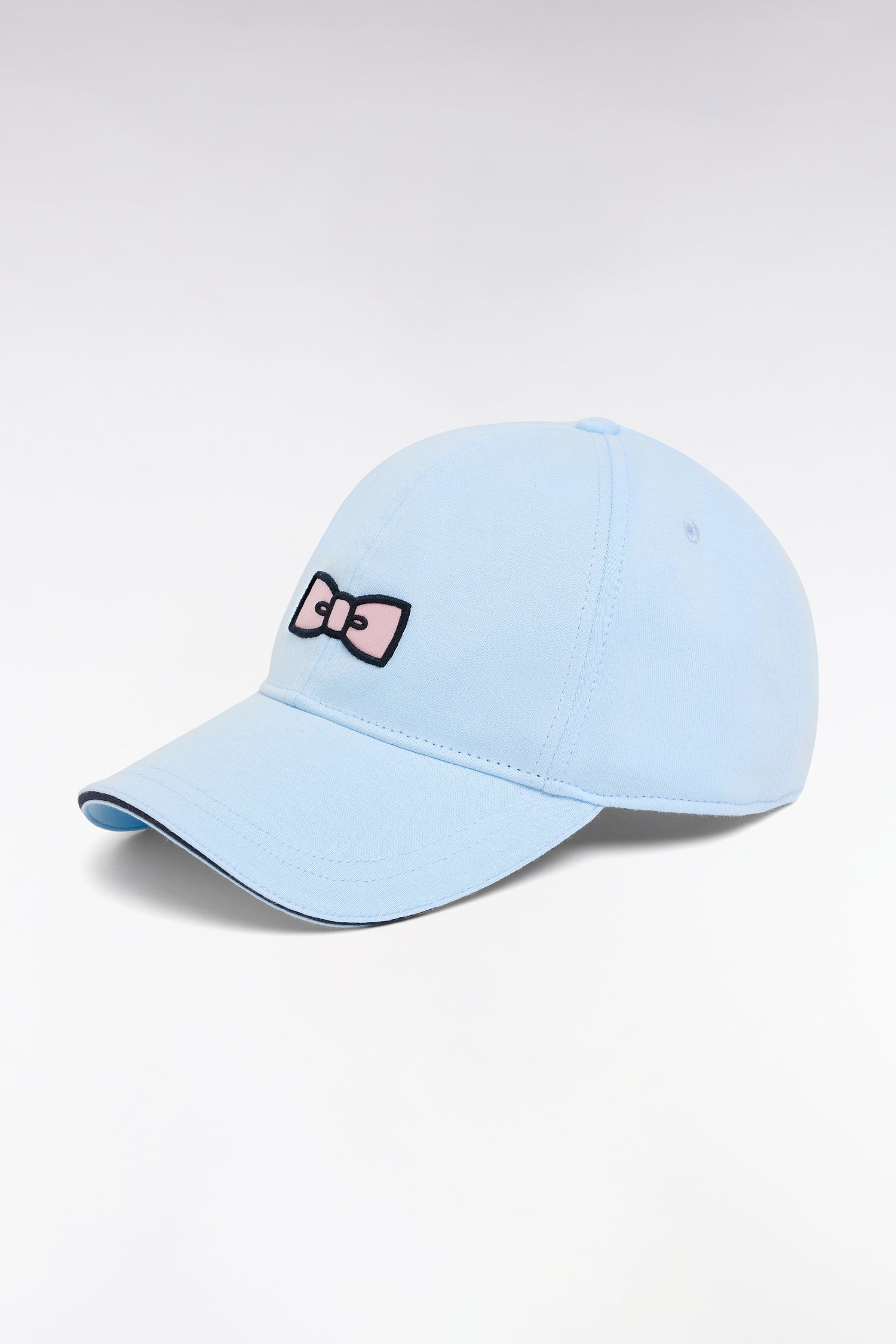 Casquette en coton ciel broderie nœud papillon rose EDEN PARK